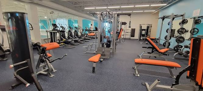 The gymnasium inside the Cape Canaveral Community Center, with
                          exercise equipment, weight machines and benches.
